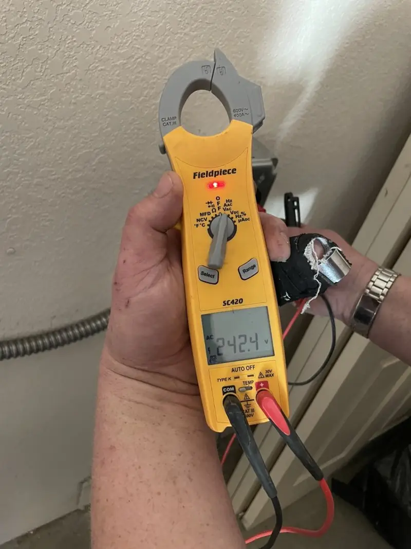 Voltage testing with clamp meter during Recessed Lighting Installation in Palmetto